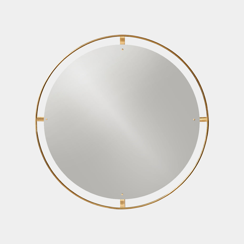 Nimbus Wall Mirror by Audo Copenhagen in polished brass with round reflective glass on neutral background