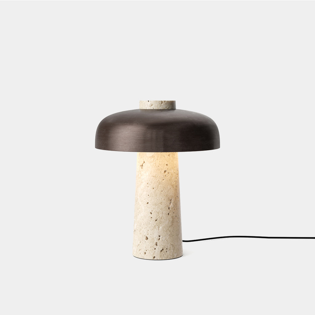 Reverse Table Lamp by Audo Copenhagen with travertine base and bronzed aluminum shade on neutral background