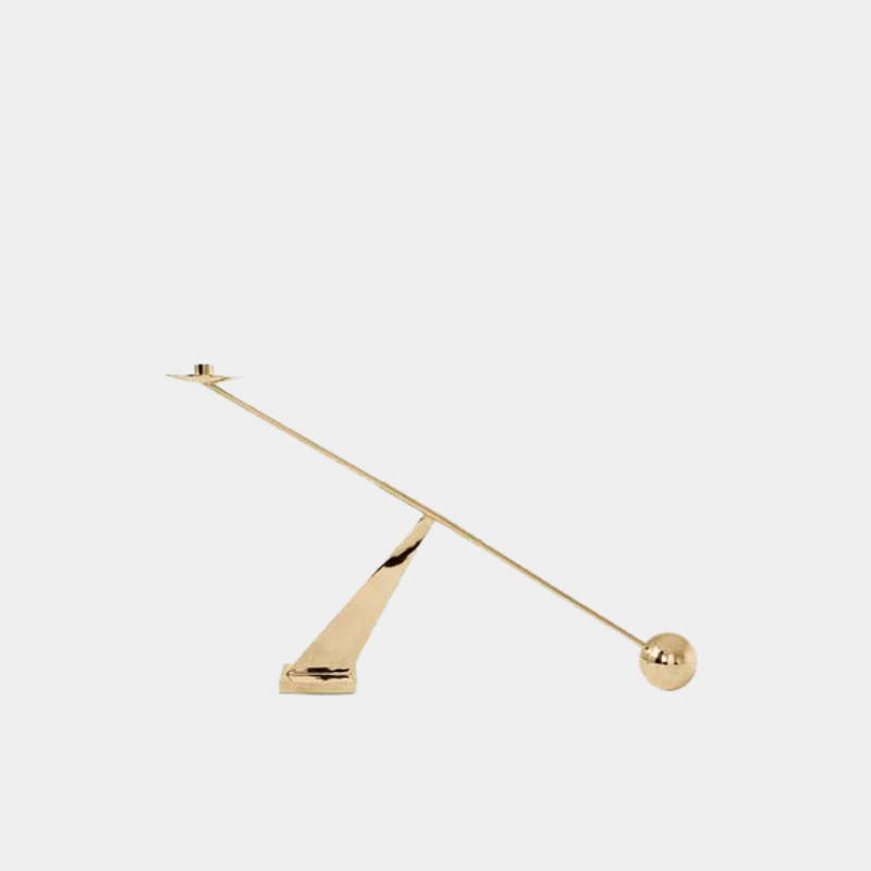 Audo Copenhagen Interconnect Candle Holder in brass with sculptural geometric form, shown on a neutral background.