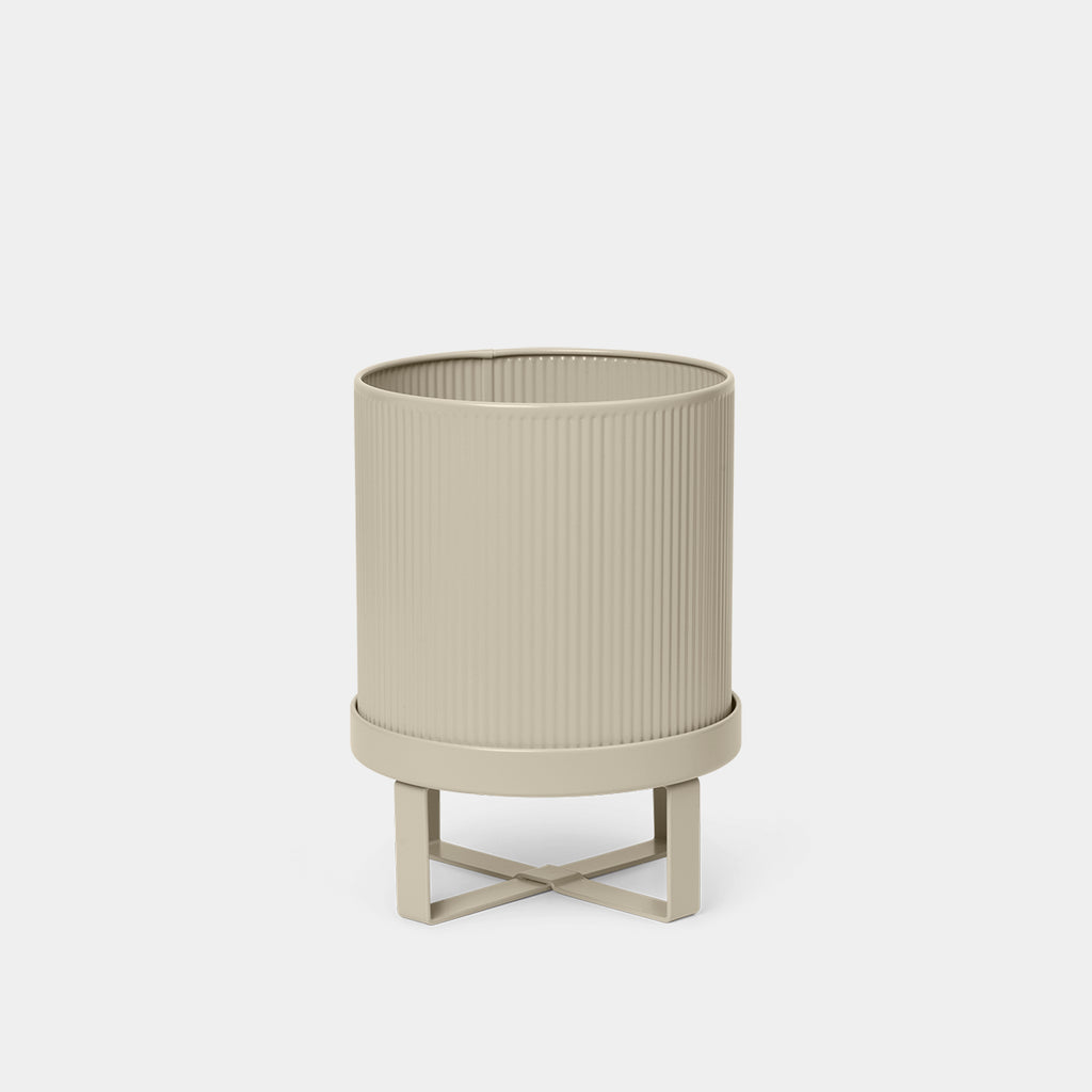Ferm Living Bau Pot in Cashmere, Small — neutral steel planter with sculptural, modernist design.