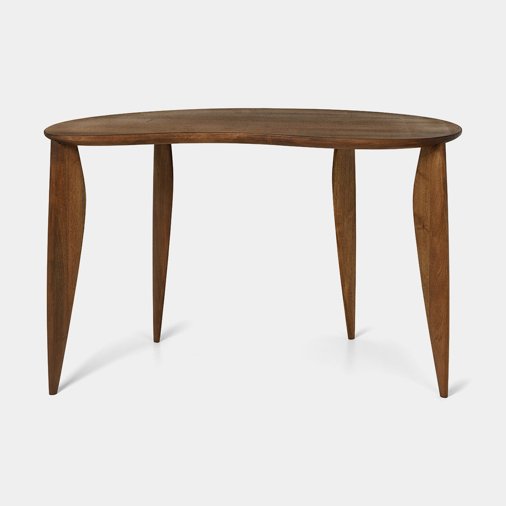 Ferm Living Feve Desk in oiled walnut, front three-quarter view showing bean-shaped top and elliptical legs.”