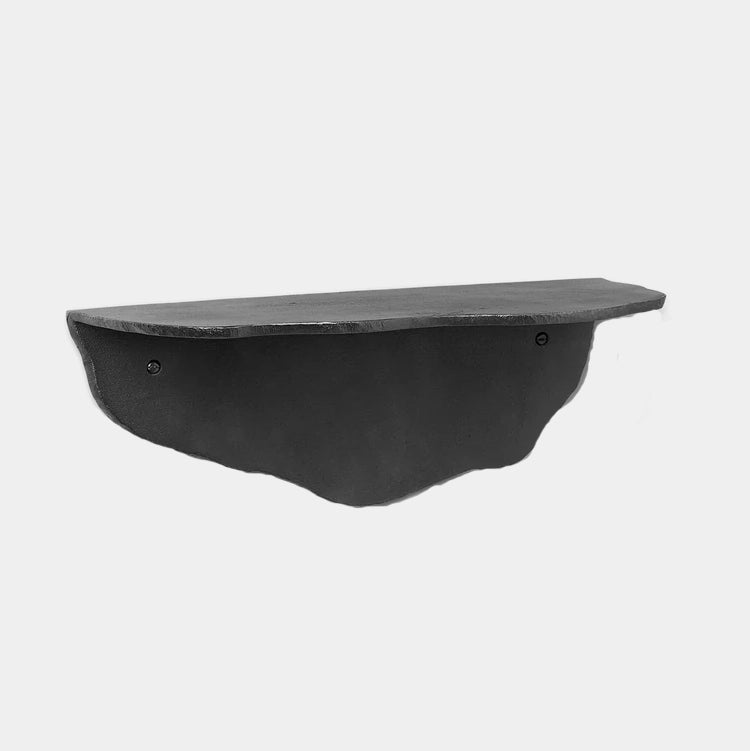 Ferm Living Fracture Shelf in blackened aluminium, sculptural wall-mounted shelf with folded design.