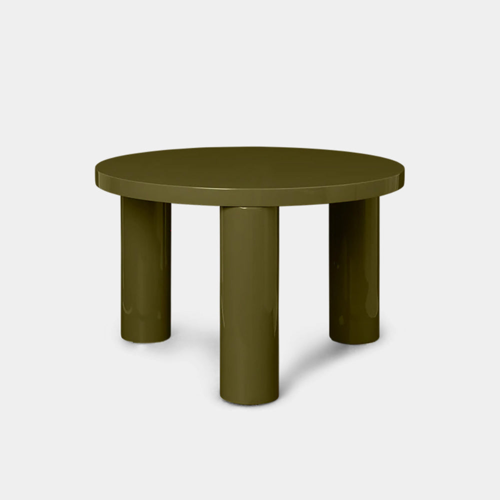 Ferm Living Post Table Small in high-gloss Olive finish with round top and cylindrical legs.