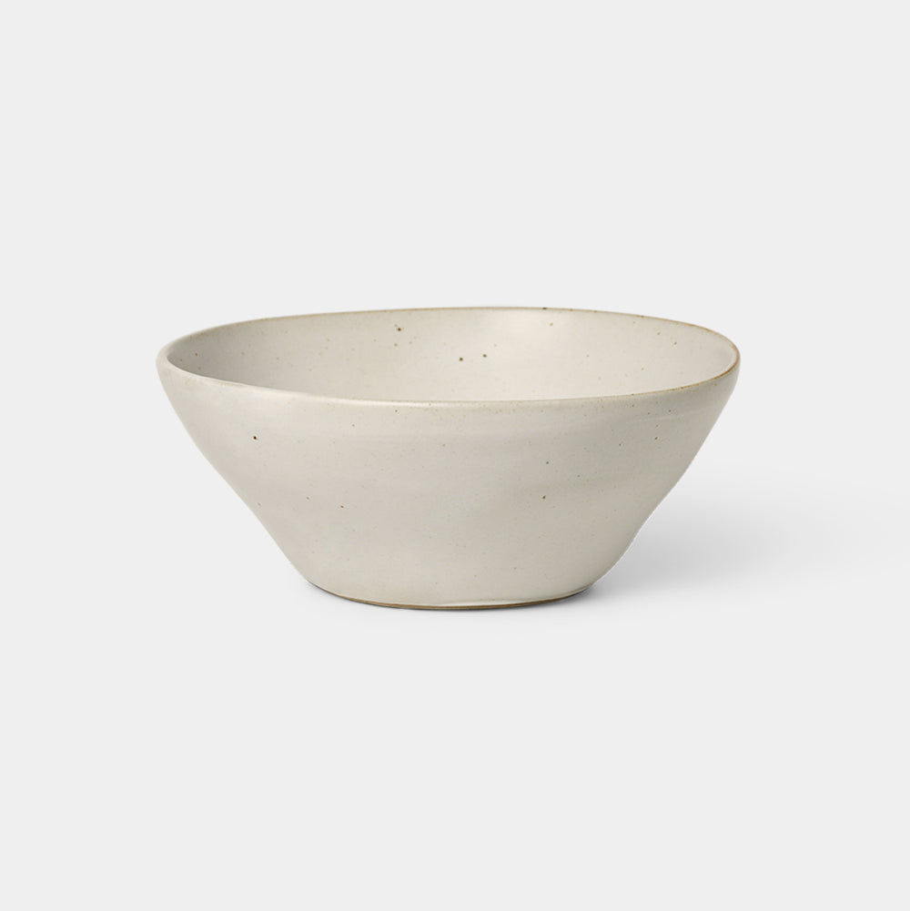 Medium Flow Bowl in Off-White glazed porcelain with semi-matte finish by Ferm Living, available at Nannie Inez.