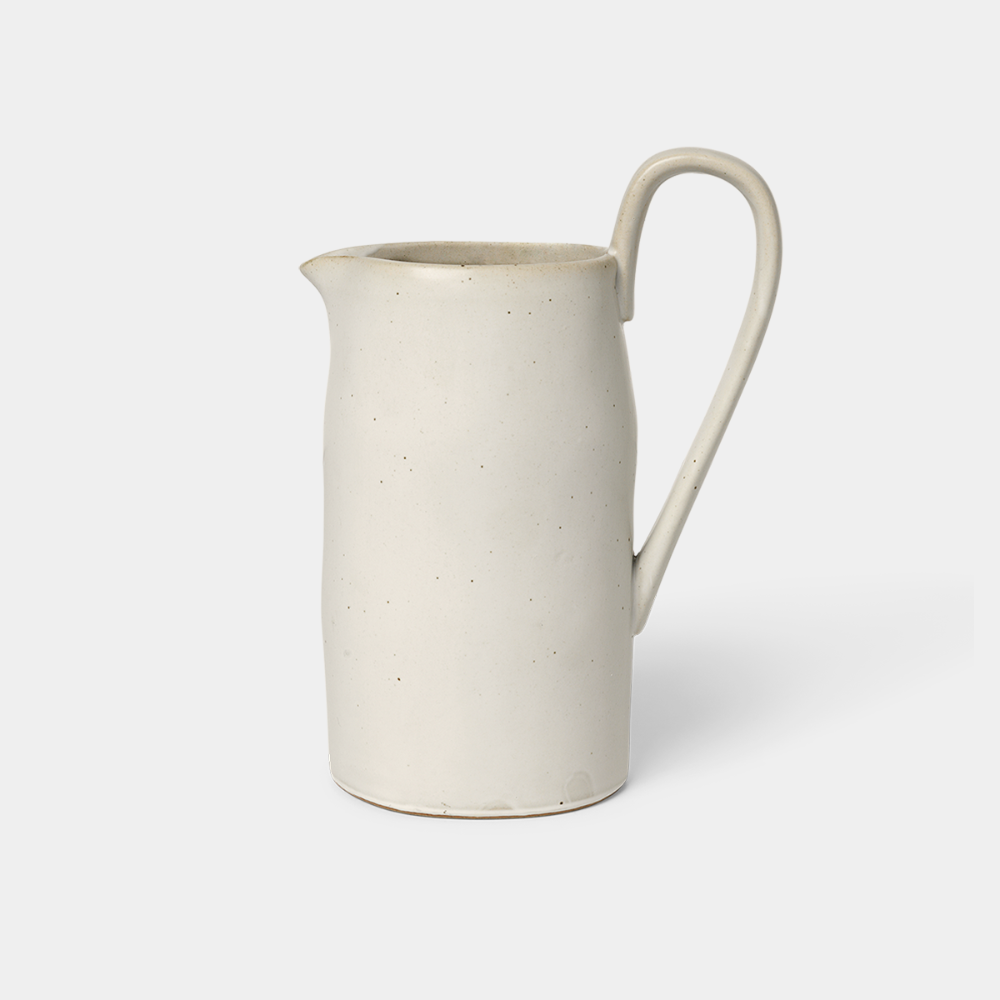 Ferm Living Flow Jug in Off-White Speckle — porcelain pitcher with semi-matte glaze and sculptural handle.