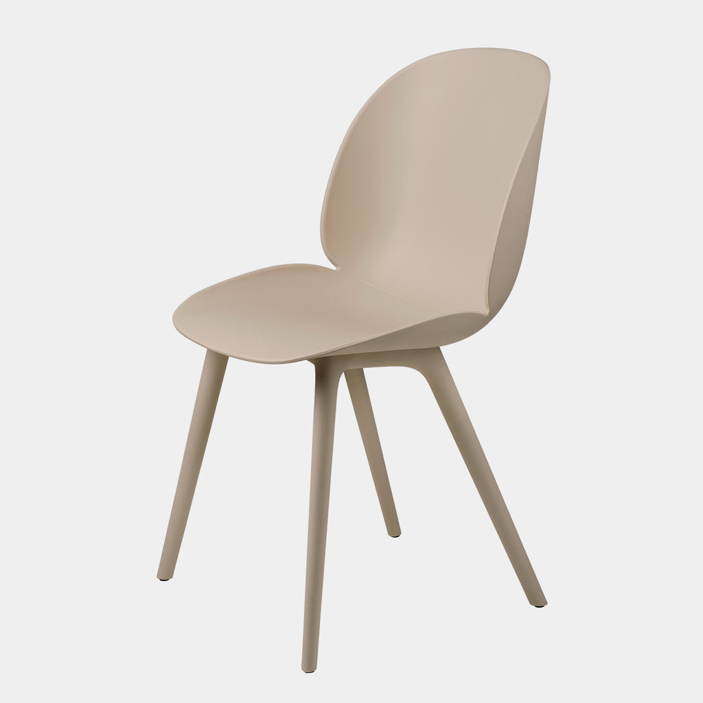 GUBI Beetle Dining Chair in New Beige polypropylene with plastic base on neutral background