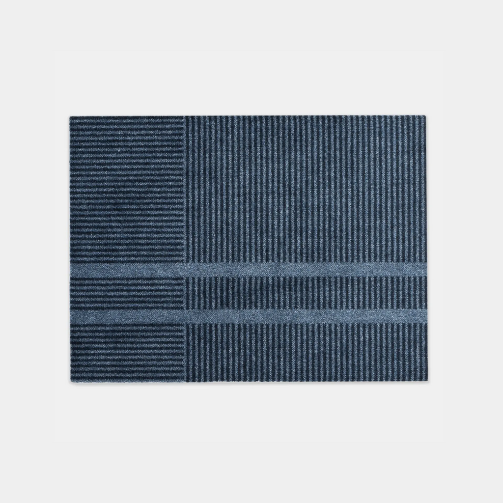 Heymat Loype Stormy Blue doormat with ski-track inspired pattern, recycled PET surface, non-slip rubber backing
