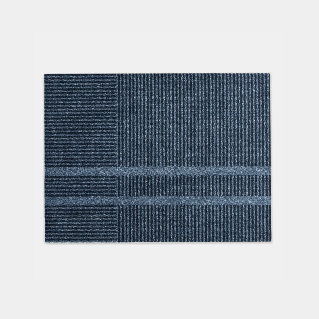 Heymat Loype Stormy Blue doormat with ski-track inspired pattern, recycled PET surface, non-slip rubber backing